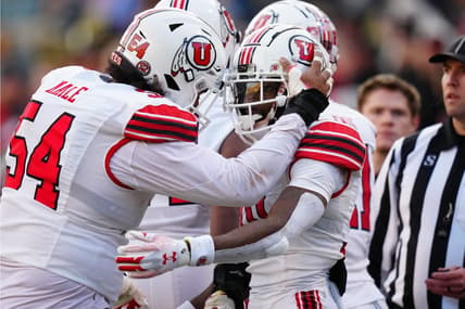 Nov 26, 2022; Boulder, Colorado, USA; Utah Utes wide receiver Money Parks (10) is congratulated for his touchdown by Utah Utes offensive lineman Paul Maile (54) in the second quarter at Folsom Field. Mandatory Credit: Ron Chenoy-USA TODAY Sports
