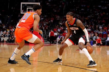 Nov 26, 2022; Houston, Texas, USA; Houston Rockets guard Jalen Green (4) handles the ball while Oklahoma City Thunder guard Aaron Wiggins (21) defends during the second quarter at Toyota Center. Mandatory Credit: Erik Williams-USA TODAY Sports