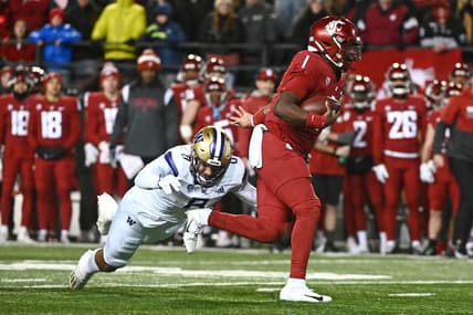 Nov 26, 2022; Pullman, Washington, USA; Washington State Cougars quarterback Cameron Ward (1) is caught from behind by Washington Huskies defensive lineman Bralen Trice (8) in first half at Gesa Field at Martin Stadium. Mandatory Credit: James Snook-USA TODAY Sports