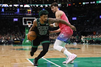 Nov 27, 2022; Boston, Massachusetts, USA; Boston Celtics guard Marcus Smart (36) goes past Washington Wizards forward Isaiah Todd (14) during the second quarter at TD Garden. Mandatory Credit: Winslow Townson-USA TODAY Sports