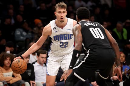 Nov 28, 2022; Brooklyn, New York, USA; Orlando Magic forward Franz Wagner (22) controls the ball against Brooklyn Nets forward Royce O'Neale (00) during the second quarter at Barclays Center. Mandatory Credit: Brad Penner-USA TODAY Sports