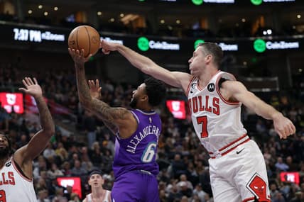 Nov 28, 2022; Salt Lake City, Utah, USA; Chicago Bulls guard Goran Dragic (7) blocks the shot of Utah Jazz guard Nickeil Alexander-Walker (6) during the second quarter at Vivint Arena. Mandatory Credit: Chris Nicoll-USA TODAY Sports