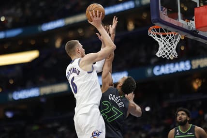 Nov 28, 2022; Washington, District of Columbia, USA; Washington Wizards center Kristaps Porzingis (6) shoots the ball over Minnesota Timberwolves center Rudy Gobert (27) in the third quarter at Capital One Arena. Mandatory Credit: Geoff Burke-USA TODAY Sports