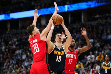 Nov 28, 2022; Denver, Colorado, USA; Denver Nuggets center Nikola Jokic (15) shoots past Houston Rockets center Alperen Sengun (28) in the second quarter at Ball Arena. Mandatory Credit: Ron Chenoy-USA TODAY Sports