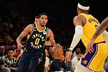 Nov 28, 2022; Los Angeles, California, USA; Indiana Pacers guard Tyrese Haliburton (0) controls the ball against Los Angeles Lakers guard Russell Westbrook (0) in the first half at Crypto.com Arena. Mandatory Credit: Richard Mackson-USA TODAY Sports