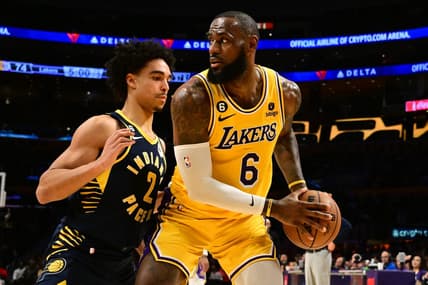 Nov 28, 2022; Los Angeles, California, USA; Los Angeles Lakers forward LeBron James (6) controls the ball against Indiana Pacers guard Andrew Nembhard (2) in the second half at Crypto.com Arena. Mandatory Credit: Richard Mackson-USA TODAY Sports