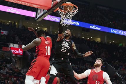 Nov 29, 2022; Portland, Oregon, USA;  LA Clippers forward Robert Covington (23) dunks the basketball during the first half against Portland Trail Blazers forward Nassir Little (10) at Moda Center. Mandatory Credit: Troy Wayrynen-USA TODAY Sports