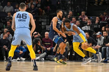 Nov 30, 2022; Minneapolis, Minnesota, USA;  Memphis Grizzlies forward Jaren Jackson Jr. (13) controls the ball as Minnesota Timberwolves forward Kyle Anderson (5) defends during the first quarter at Target Center. Mandatory Credit: Nick Wosika-USA TODAY Sports