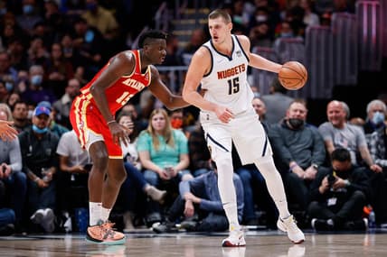 Nov 12, 2021; Denver, Colorado, USA; Denver Nuggets center Nikola Jokic (15) controls the ball as Atlanta Hawks center Clint Capela (15) guards in the third quarter at Ball Arena. Mandatory Credit: Isaiah J. Downing-USA TODAY Sports