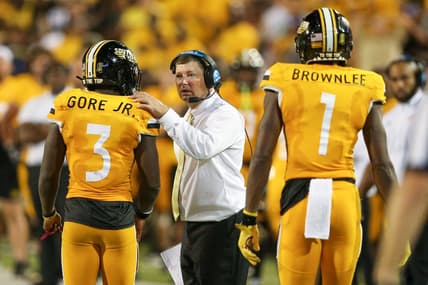Sep 3, 2022; Hattiesburg, Mississippi, USA; Southern Miss Golden Eagles head coach Will Hall talks to running back Frank Gore Jr. (3) in the second half at M.M. Roberts Stadium. Liberty won in overtime, 29-27. Mandatory Credit: Chuck Cook-USA TODAY Sports
