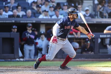 Sep 24, 2022; Bronx, New York, USA;  Boston Red Sox shortstop Xander Bogaerts (2) hits a single in the seventh inning against the New York Yankees at Yankee Stadium. Mandatory Credit: Wendell Cruz-USA TODAY Sports