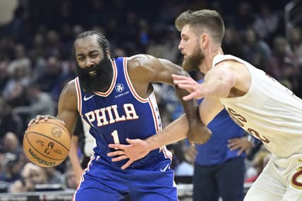 Oct 10, 2022; Cleveland, Ohio, USA; Philadelphia 76ers guard James Harden (1) drives against Cleveland Cavaliers forward Dean Wade (32) in the second quarter at Rocket Mortgage FieldHouse. Mandatory Credit: David Richard-USA TODAY Sports