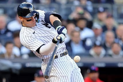 Oct 18, 2022; Bronx, New York, USA; New York Yankees right fielder Aaron Judge (99) hits a home run against the Cleveland Guardians during the second inning in game five of the ALDS for the 2022 MLB Playoffs at Yankee Stadium. Mandatory Credit: Brad Penner-USA TODAY Sports