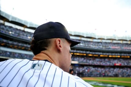 Oct 22, 2022; Bronx, New York, USA; New York Yankees right fielder Aaron Judge (99) looks out of the dugout before taking the field for the start of game three of the ALCS against the Houston Astros during the 2022 MLB Playoffs at Yankee Stadium. Mandatory Credit: Brad Penner-USA TODAY Sports