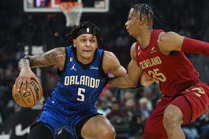 Oct 26, 2022; Cleveland, Ohio, USA; Orlando Magic forward Paolo Banchero (5) drives to the basket against Cleveland Cavaliers forward Isaac Okoro (35) during the first half at Rocket Mortgage FieldHouse. Mandatory Credit: Ken Blaze-USA TODAY Sports