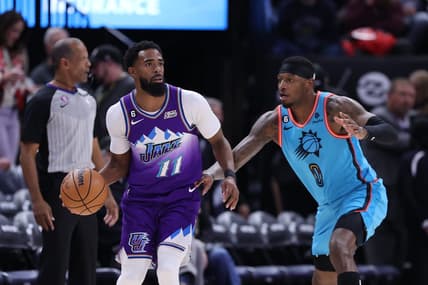 Nov 18, 2022; Salt Lake City, Utah, USA; Utah Jazz guard Mike Conley (11) looks to pass the ball against Phoenix Suns forward Torrey Craig (0) in the first half at Vivint Arena. Mandatory Credit: Rob Gray-USA TODAY Sports