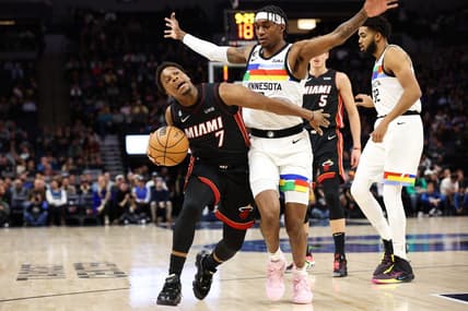 Nov 21, 2022; Minneapolis, Minnesota, USA; Miami Heat guard Kyle Lowry (7) dribbles the ball while Minnesota Timberwolves forward Jaden McDaniels (3) defends during the first quarter at Target Center. Mandatory Credit: Matt Krohn-USA TODAY Sports