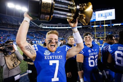 Nov 26, 2022; Lexington, Kentucky, USA; Kentucky Wildcats quarterback Will Levis (7) holds up the Governor   s Cup trophy after winning the game against the Louisville Cardinals at Kroger Field. Mandatory Credit: Jordan Prather-USA TODAY Sports