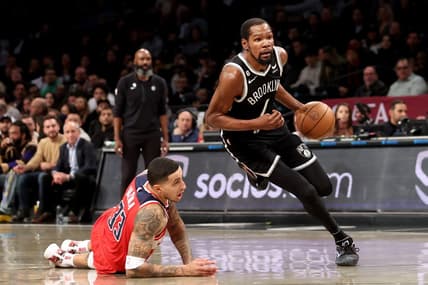 Nov 30, 2022; Brooklyn, New York, USA; Brooklyn Nets forward Kevin Durant (7) drives to the basket against Washington Wizards forward Kyle Kuzma (33) during the first quarter at Barclays Center. Mandatory Credit: Brad Penner-USA TODAY Sports