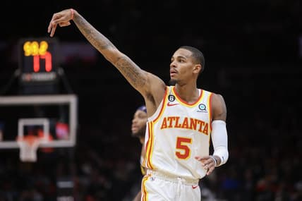 Dec 2, 2022; Atlanta, Georgia, USA; Atlanta Hawks guard Dejounte Murray (5) reacts after a three-point basket against the Denver Nuggets in the second quarter at State Farm Arena. Mandatory Credit: Brett Davis-USA TODAY Sports