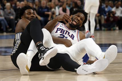 Dec 2, 2022; Memphis, Tennessee, USA; Memphis Grizzlies forward Jaren Jackson Jr. (13) and Philadelphia 76ers center Joel Embiid (21) get tangled up as they battle for a rebound during the first half at FedExForum. Mandatory Credit: Petre Thomas-USA TODAY Sports