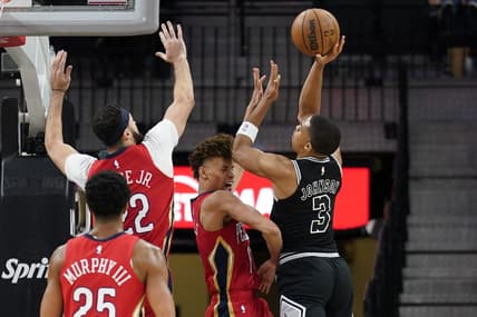 Dec 2, 2022; San Antonio, Texas, USA; San Antonio Spurs forward Keldon Johnson (3) shoots over New Orleans Pelicans guard Dyson Daniels (11) and forward Larry Nance Jr. (22) during the first half at AT&T Center. Mandatory Credit: Scott Wachter-USA TODAY Sports