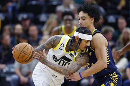 Dec 2, 2022; Salt Lake City, Utah, USA; Utah Jazz guard Jordan Clarkson (00) looks to drive on Indiana Pacers guard Andrew Nembhard (2) in the first quarter at Vivint Arena. Mandatory Credit: Jeffrey Swinger-USA TODAY Sports