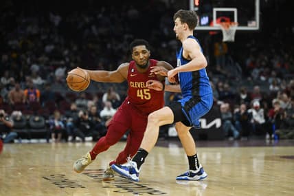 Dec 2, 2022; Cleveland, Ohio, USA; Cleveland Cavaliers guard Donovan Mitchell (45) drives to the basket against Orlando Magic forward Franz Wagner (22) during the second half at Rocket Mortgage FieldHouse. Mandatory Credit: Ken Blaze-USA TODAY Sports