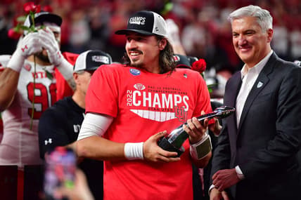 Dec 2, 2022; Las Vegas, NV, USA; Utah Utes quarterback Cameron Rising (7) celebrates after being named MVP in the victory against the Southern California Trojans in the PAC-12 Football Championship at Allegiant Stadium. Mandatory Credit: Gary A. Vasquez-USA TODAY Sports