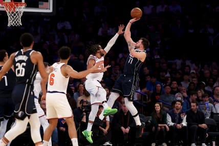 Dec 3, 2022; New York, New York, USA; Dallas Mavericks guard Luka Doncic (77) shoots over New York Knicks guard Jalen Brunson (11) during the third quarter at Madison Square Garden. Mandatory Credit: Brad Penner-USA TODAY Sports