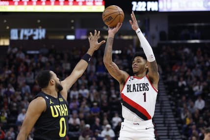 Dec 3, 2022; Salt Lake City, Utah, USA; Portland Trail Blazers guard Anfernee Simons (1) shoots over Utah Jazz guard Talen Horton-Tucker (0) in the first quarter at Vivint Arena. Mandatory Credit: Jeffrey Swinger-USA TODAY Sports