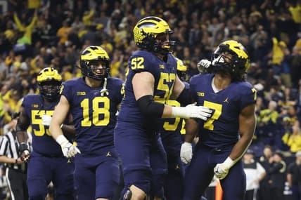 Dec 3, 2022; Indianapolis, Indiana, USA; Michigan Wolverines running back Donovan Edwards (7) celebrates after scoring on a 27-yard touchdown run during the second half of the Big Ten Championship against the Purdue Boilermakers at Lucas Oil Stadium. Mandatory Credit: Trevor Ruszkowski-USA TODAY Sports