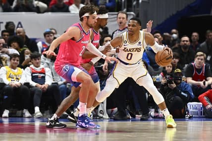 Dec 4, 2022; Washington, District of Columbia, USA; Los Angeles Lakers guard Russell Westbrook (0) dribbles as Washington Wizards forward Corey Kispert (24) looks on during the first half at Capital One Arena. Mandatory Credit: Brad Mills-USA TODAY Sports