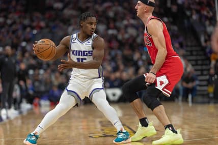 Dec 4, 2022; Sacramento, California, USA; Sacramento Kings guard Davion Mitchell (15) looks to pass the ball during the second quarter against Chicago Bulls guard Alex Caruso (6) at Golden 1 Center. Mandatory Credit: Stan Szeto-USA TODAY Sports