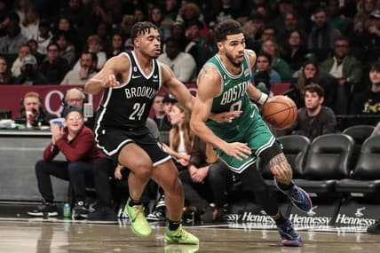 Dec 4, 2022; Brooklyn, New York, USA;  Boston Celtics forward Jayson Tatum (0) drives past Brooklyn Nets guard Cam Thomas (24) in the second quarter at Barclays Center. Mandatory Credit: Wendell Cruz-USA TODAY Sports