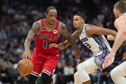 Dec 4, 2022; Sacramento, California, USA;  Chicago Bulls forward DeMar DeRozan (11) drives around Sacramento Kings forward Keegan Murray (13) during the third quarter at Golden 1 Center. Mandatory Credit: Stan Szeto-USA TODAY Sports