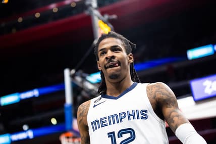 Dec 4, 2022; Detroit, Michigan, USA; Memphis Grizzlies guard Ja Morant (12) looks at the crowd after making a basket in the second half against the Detroit Pistons at Little Caesars Arena. Mandatory Credit: Allison Farrand-USA TODAY Sports
