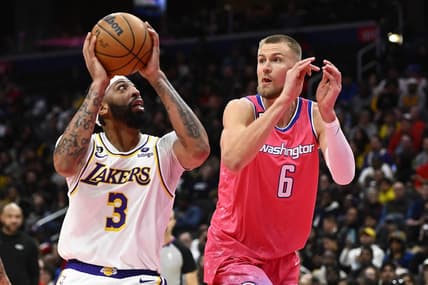 Dec 4, 2022; Washington, District of Columbia, USA; Los Angeles Lakers forward Anthony Davis (3) shoots as Washington Wizards center Kristaps Porzingis (6) defends during the second half at Capital One Arena. Mandatory Credit: Brad Mills-USA TODAY Sports