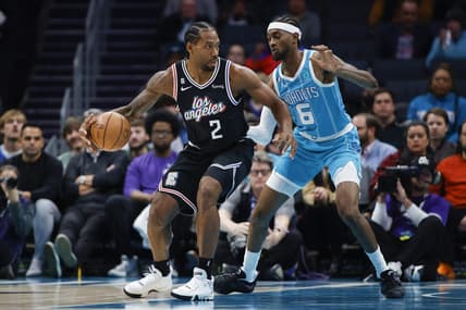 Dec 5, 2022; Charlotte, North Carolina, USA; Los Angeles Clippers forward Kawhi Leonard (2) drives against Charlotte Hornets forward Jalen McDaniels (6) during the first half at Spectrum Center. Mandatory Credit: Nell Redmond-USA TODAY Sports