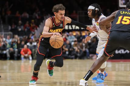 Dec 5, 2022; Atlanta, Georgia, USA; Atlanta Hawks guard Trae Young (11) drives on Oklahoma City Thunder forward Luguentz Dort (5) in the first quarter at State Farm Arena. Mandatory Credit: Brett Davis-USA TODAY Sports