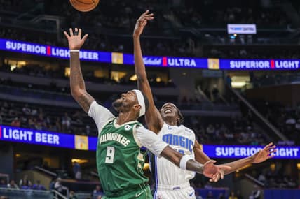 Dec 5, 2022; Orlando, Florida, USA; Milwaukee Bucks forward Bobby Portis (9) and Orlando Magic center Bol Bol (10) jump for the rebound during the second quarter at Amway Center. Mandatory Credit: Mike Watters-USA TODAY Sports