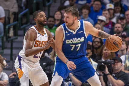 Dec 5, 2022; Dallas, Texas, USA; Phoenix Suns forward Mikal Bridges (25) guards Dallas Mavericks guard Luka Doncic (77) during the first quarter at the American Airlines Center. Mandatory Credit: Jerome Miron-USA TODAY Sports