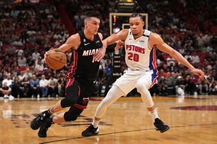 Dec 6, 2022; Miami, Florida, USA; Miami Heat guard Tyler Herro (14) drives the ball around Detroit Pistons forward Kevin Knox II (20) during the first half at FTX Arena. Mandatory Credit: Jasen Vinlove-USA TODAY Sports