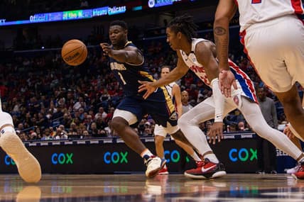 Dec 7, 2022; New Orleans, Louisiana, USA;  New Orleans Pelicans forward Zion Williamson (1) recovers a loose ball from Detroit Pistons guard Jaden Ivey (23) during the first half at Smoothie King Center. Mandatory Credit: Stephen Lew-USA TODAY Sports