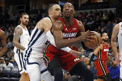 Dec 5, 2022; Memphis, Tennessee, USA; Miami Heat center Bam Adebayo (13) drives to the basket as Memphis Grizzlies forward Dillon Brooks (24) defends during the first half at FedExForum. Mandatory Credit: Petre Thomas-USA TODAY Sports