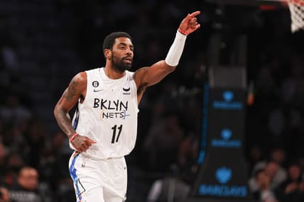 Dec 7, 2022; Brooklyn, New York, USA; Brooklyn Nets guard Kyrie Irving (11) reacts after a basket during the first quarter against the Charlotte Hornets at Barclays Center. Mandatory Credit: Vincent Carchietta-USA TODAY Sports