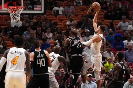 Dec 8, 2022; Miami, Florida, USA; LA Clippers forward Robert Covington (23) blocks the shot of Miami Heat guard Max Strus (31) during the first half at FTX Arena. Mandatory Credit: Jasen Vinlove-USA TODAY Sports
