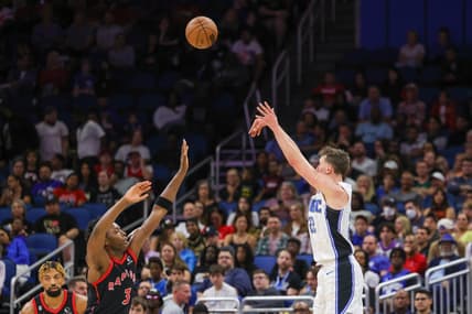 Dec 9, 2022; Orlando, Florida, USA; Orlando Magic forward Franz Wagner (22) shoots the ball over Toronto Raptors forward O.G. Anunoby (3) during the second quarter at Amway Center. Mandatory Credit: Mike Watters-USA TODAY Sports