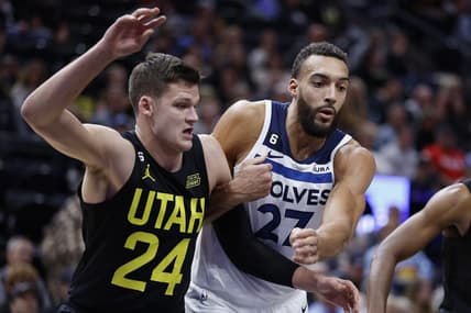 Dec 9, 2022; Salt Lake City, Utah, USA; Utah Jazz center Walker Kessler (24) and Minnesota Timberwolves center Rudy Gobert (27) battle in the first half at Vivint Arena. Mandatory Credit: Jeffrey Swinger-USA TODAY Sports
