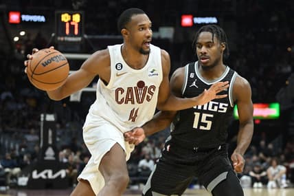 Dec 9, 2022; Cleveland, Ohio, USA; Cleveland Cavaliers forward Evan Mobley (4) drives to the basket against Sacramento Kings guard Davion Mitchell (15) during the second half at Rocket Mortgage FieldHouse. Mandatory Credit: Ken Blaze-USA TODAY Sports